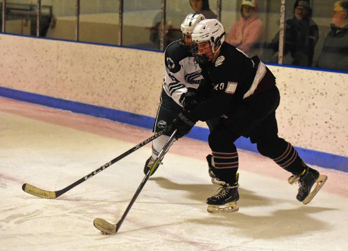 Amherst’s Ben Remensnyder (20) moves the puck against Greenfield during the visiting Hurricanes’ 3-1 victory on Monday at Collins-Moylan Arena in Greenfield.