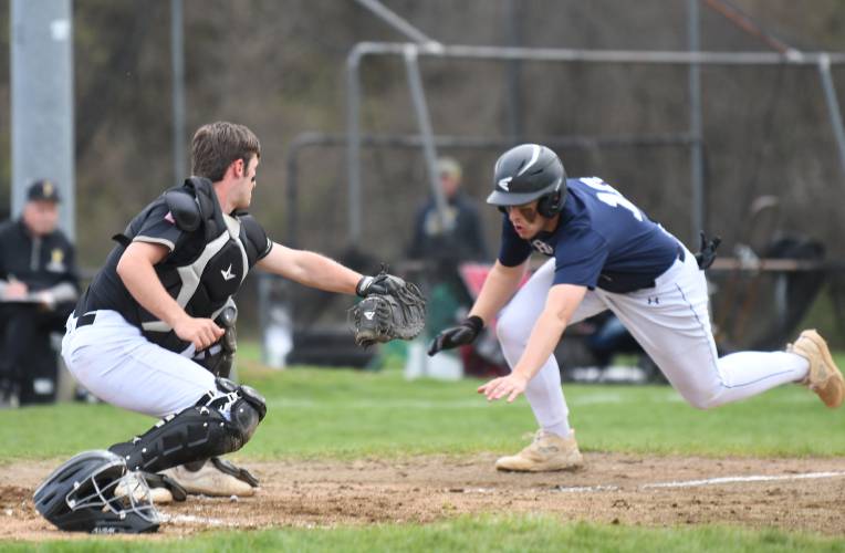 Frontier’s Tyler Cusson tries to avoid the tag at home from Pioneer Braeden Tsipenyuk in Northfield earlier this season.  