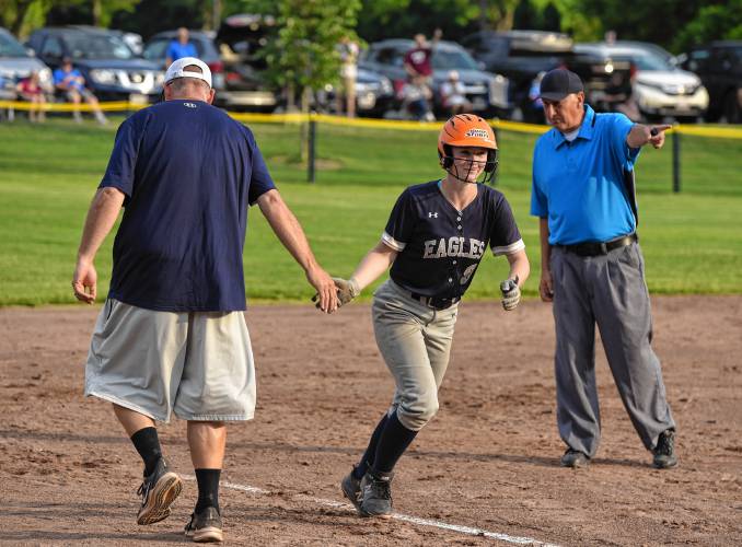 Franklin Tech’s Hannah Gilbert high-fives head coach Joe Gamache en route to scoring a run against Lenox during the Eagles’ 10-5 victory in the MIAA Division 5 Round of 16 on Tuesday at Nancy Gifford Field in Turners Falls.