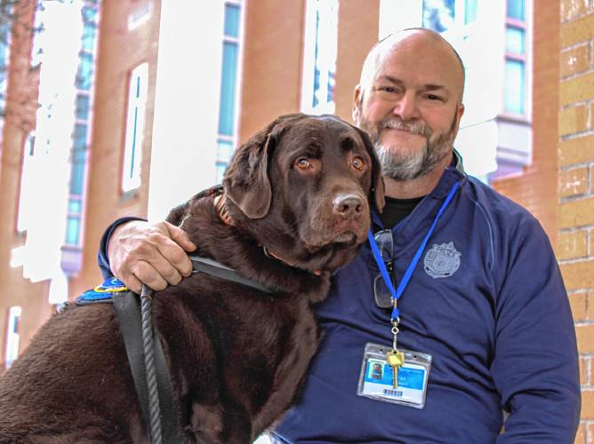 Gill-Montague Regional School District School Resource Officer Dan Miner, pictured with K-9 Mack, the school district’s comfort dog. Miner’s position is being cut in the school district’s fiscal year 2026 budget.