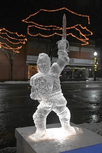 Mark Bosworth, of Athol, won first place for his ice sculpture of a knight wielding a sword. He said he anticipated carving some sort of winged creature, but typically likes to sculpt something “out of his head” when he looks at the ice block.