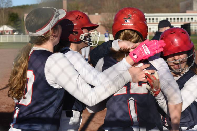 Frontier’s Delaney Fifield (12) is mobbed by teammates after scoring the winning run against Turners Falls in a 2-1 victory on Wednesday at Zabek Field in South Deerfield.