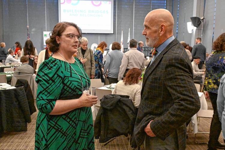 Greenfield Community College President Michelle Schutt speaks with Franklin County’s YMCA CEO Grady Vigneau at the GCC Foundation’s “Building Bridges and Belonging: GCC’s Celebration of Community” fundraising dinner last week.