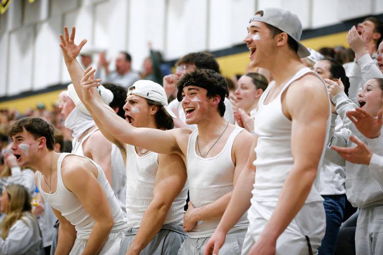 Pioneer fans celebrate after scoring against Ware during the MIAA Division 5 quarterfinal Friday night in Northfield.