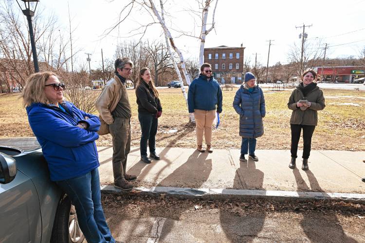 Montague Public Libraries Director Caitlin Kelley, right, answers questions as officials tour a possible new site for a library at 38 Avenue A in Turners Falls.