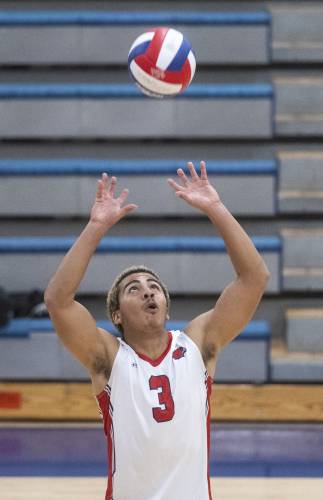 Frontier's Tavo Vincent-Warner sets the ball during the volleyball game against West Springfield at Frontier High School, Tuesday, April 8, 2025, in South Deerfield.