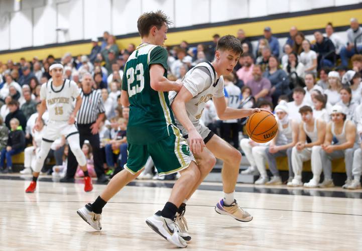 Pioneer’s Brayden Thayer (10) drives the ball against Ware defender Owen McKeever (23) in the third quarter of the MIAA Division 5 quarterfinal Friday night in Northfield.