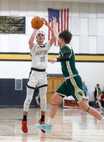 Pioneer’s Alex McClelland (15) takes a three-point shot against Ware in the third quarter of the MIAA Division 5 quarterfinal Friday night in Northfield.