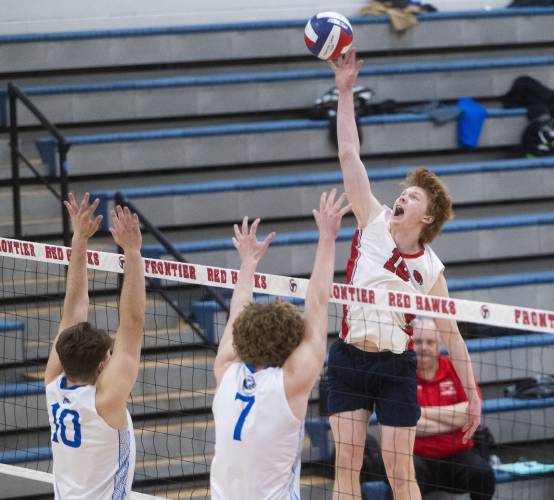Frontier's William Reading spikes the ball during the volleyball game against West Springfield at Frontier High School, Tuesday, April 8, 2025, in South Deerfield.